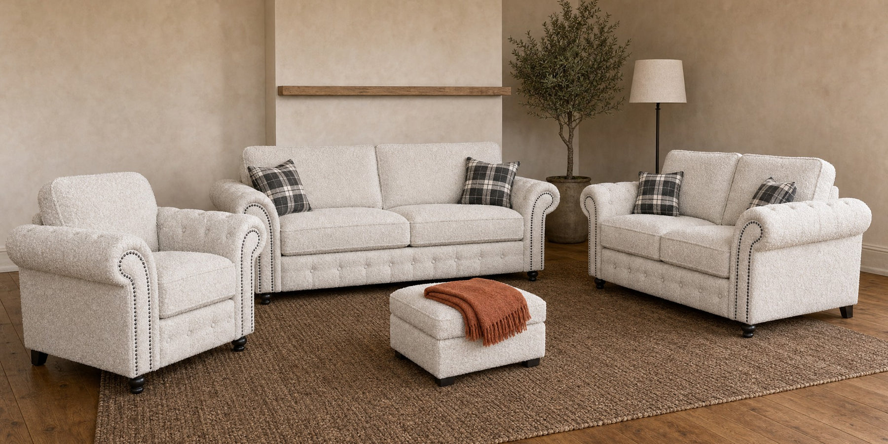 Oakland three-seater sofa, two-seater sofa, armchair and footstool in Teddy Bouclé White in a living room